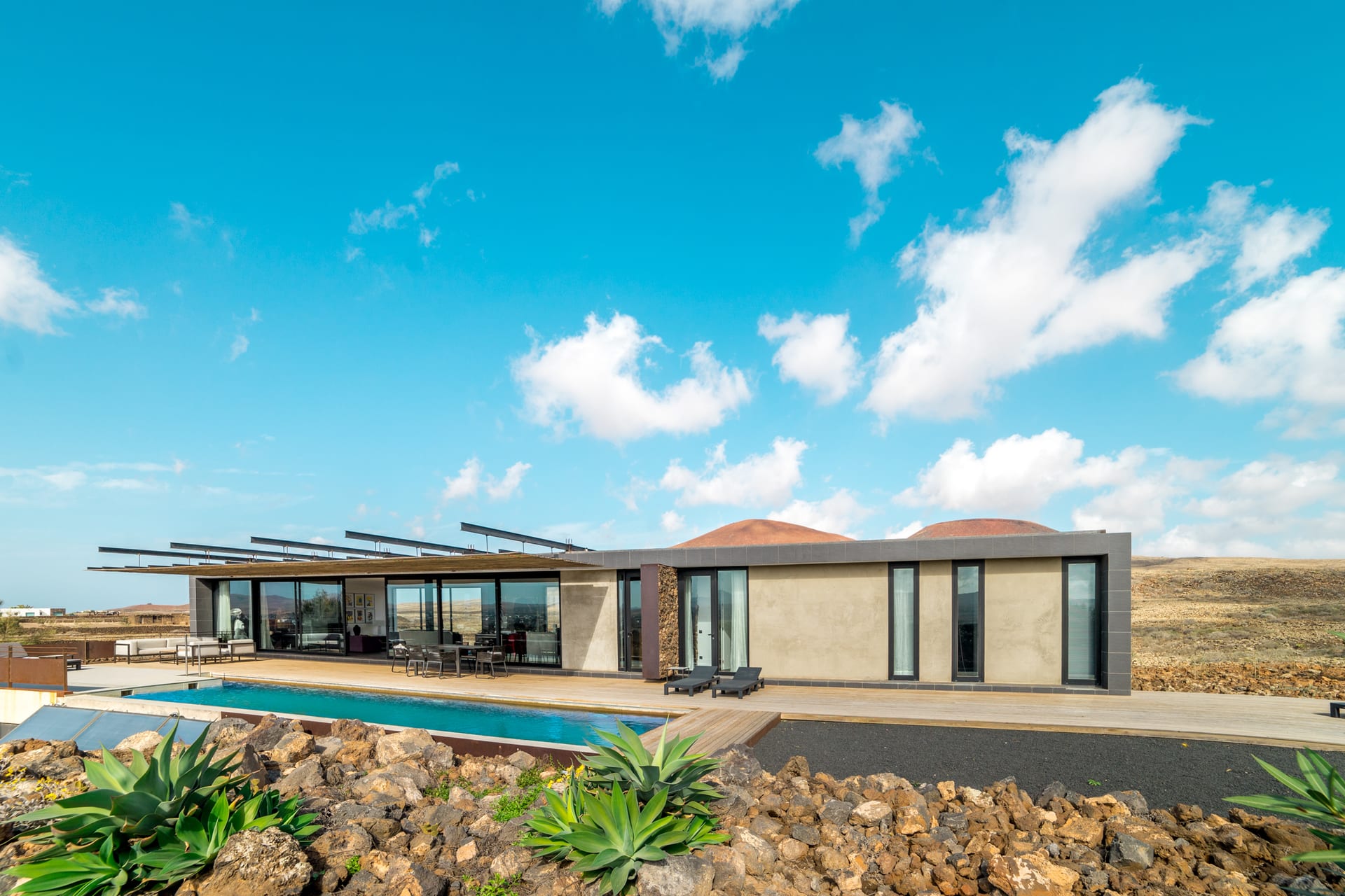 Volcanic House Fuerteventura exterior with pool and volcanic landscape